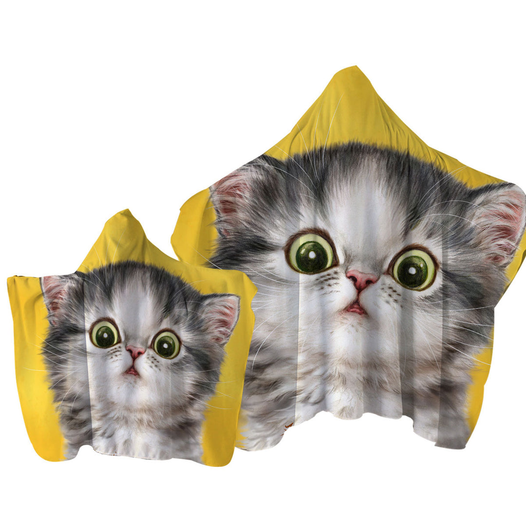 Cute Confused Kitty Cat over Yellow Hooded Beach Towel