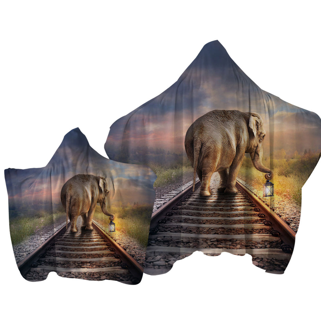 Elephant Walks on the Track Hooded Beach Towel