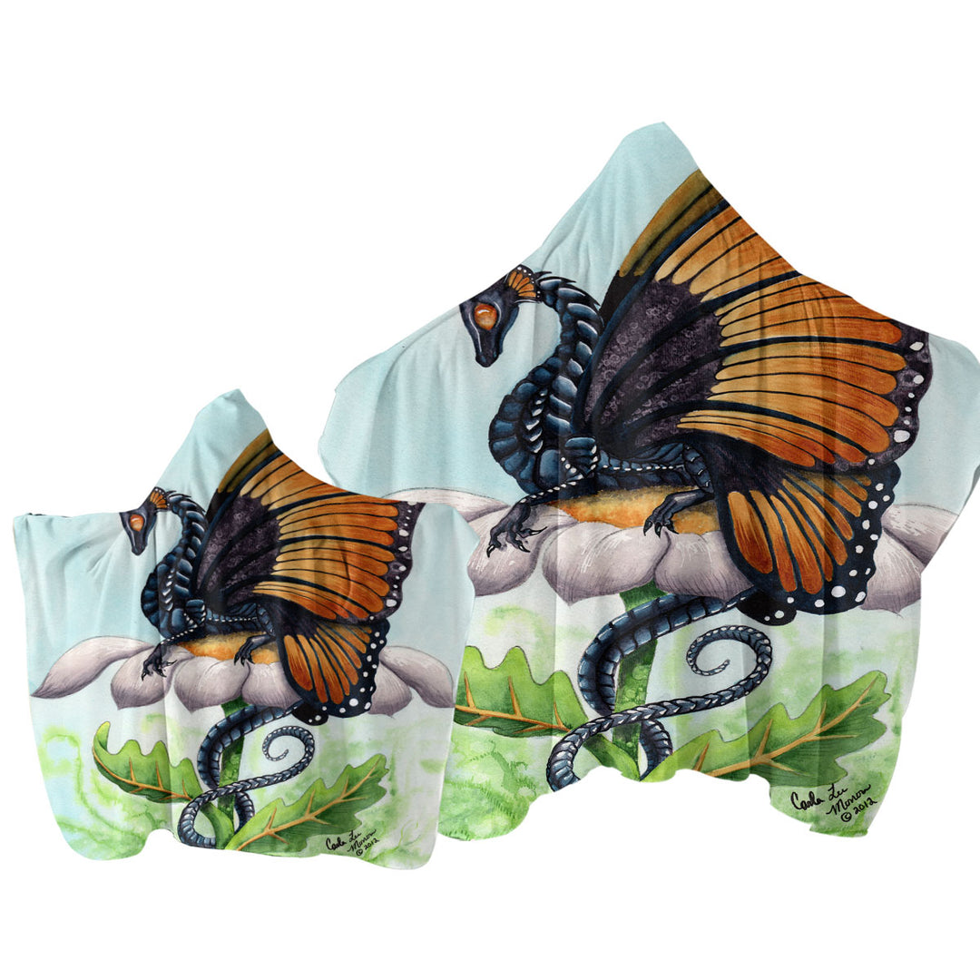 The Monarch Fantasy Art Dragon Sits on Flower Hooded Beach Towel