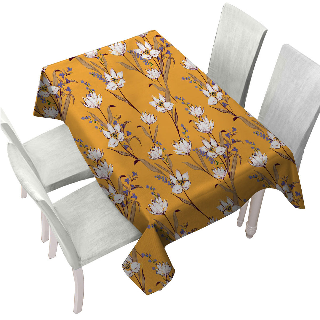 White Purple Flowers over Yellow Tablecloth