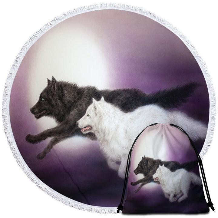 Moonlight Run Black and White Wolves Round Beach Towel